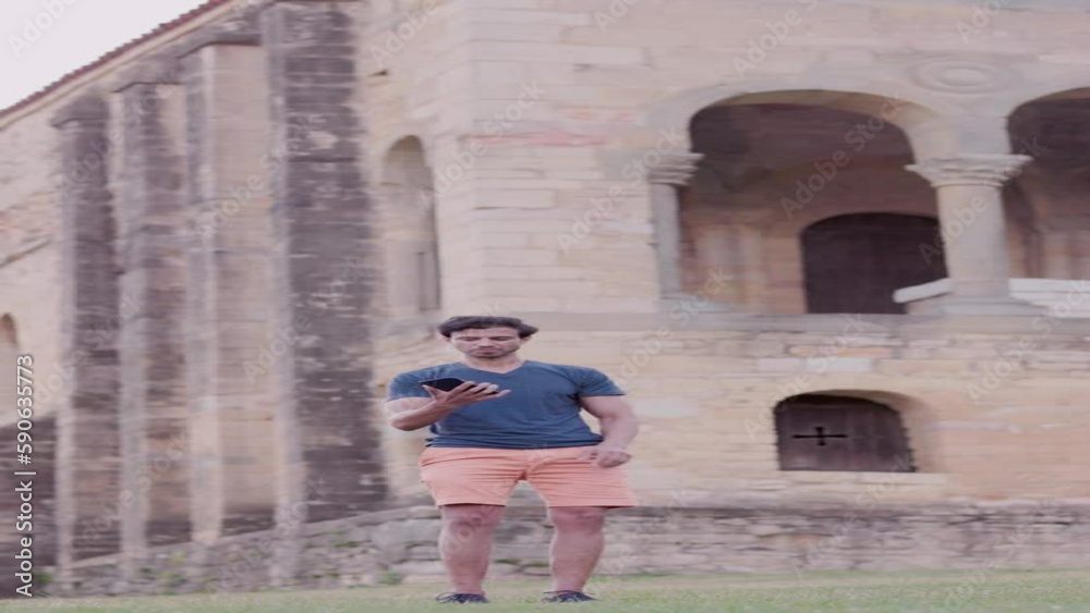 Indian Bollywood dance with smartphone. Travel content creator influencer in Asturias. Mid adult Indian Bollywood dance with smartphone. Travel content creator influencer in Asturias. Mid adult