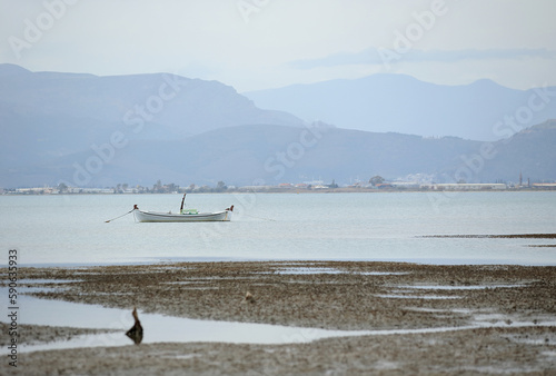 Obraz na płótnie A small fishing boat in the port. The town of Nafplio in the eastern Peloponnese (Greece). w salonie