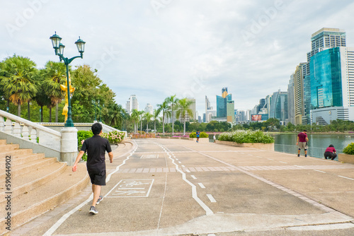 Photography People walking at Park with Cityscape view of Lake.