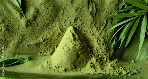 Mitragyna speciosa or Kratom Powder on a green powder background	
 photo