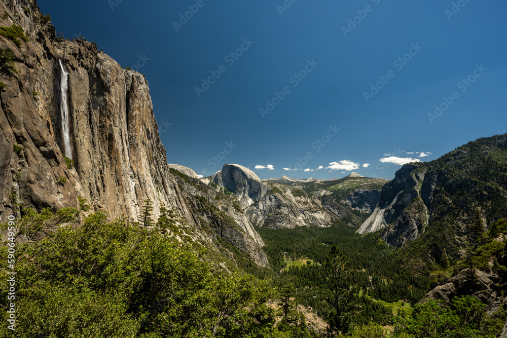 Yosemite Falls and Half Dome Tower Over Yosemite Valley