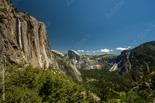 Yosemite Falls and Half Dome Tower Over Yosemite Valley