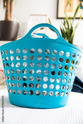 Pile of laundy in blue basket
