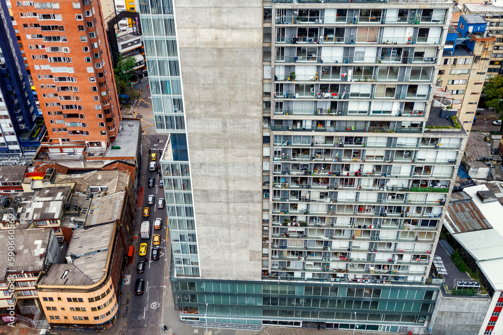 Fototapeta premium Aerial view of traffic in the streets next to skyscrapers in Bogota, Colombia