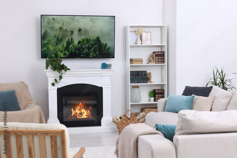 Stylish living room interior with cozy sofa, TV set and fireplace Stylish living room interior with cozy sofa, TV set and fireplace