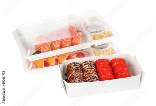 Food delivery. Containers with different delicious sushi rolls on white background