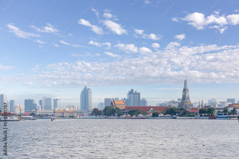 Naklejka premium Bangkok cityscape with riverside of Thailand. Thai living with main river cal Joe Praya River with Buddhism temple and residence transportation with boat cross river