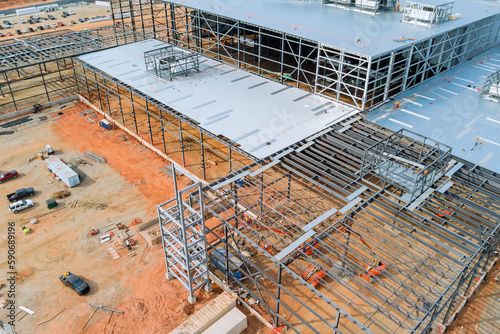 Tablou pe pânză Building truss frames for industrial warehouses as part of construction project