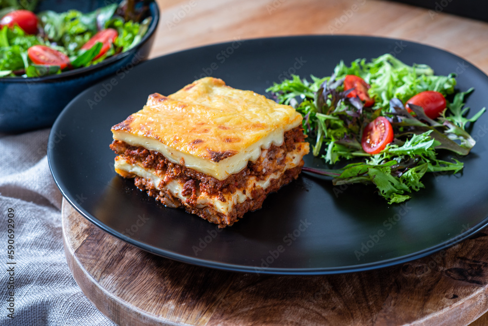 Lasagna with meat, cheese and salad