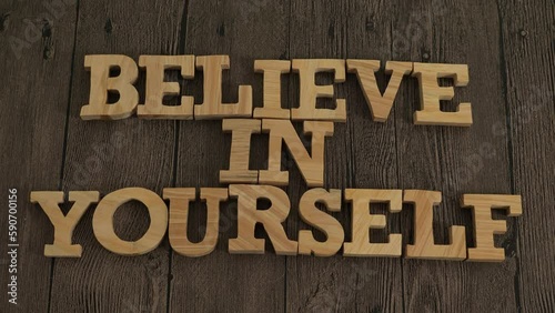 Believe in yourself, text words typography written with wooden letter, life and business motivational inspirational