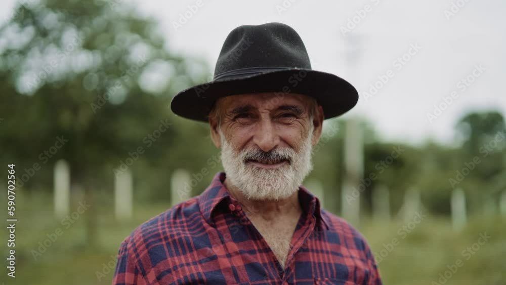 Portrait of Brazilian farmer man in the casual shirt in the farm. Cinematic 4K