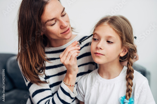 Mother and daughter do their own makeup