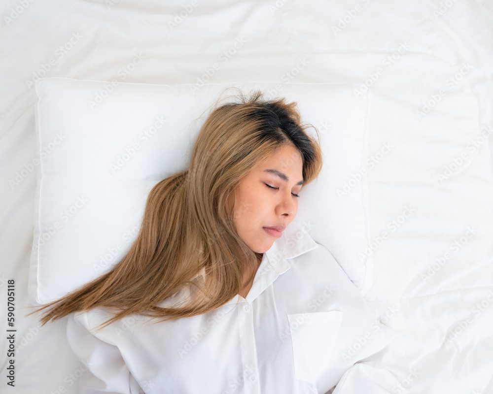 cute asian girl funny on bed with pillow cute asian girl funny on bed with pillow