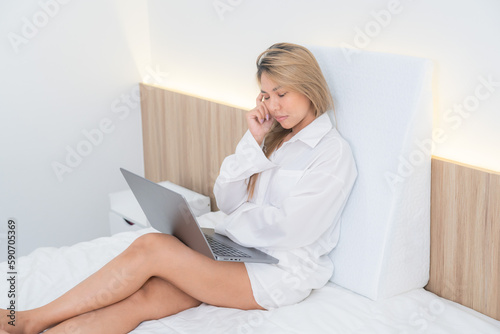 cute asian girl funny on bed with pillow