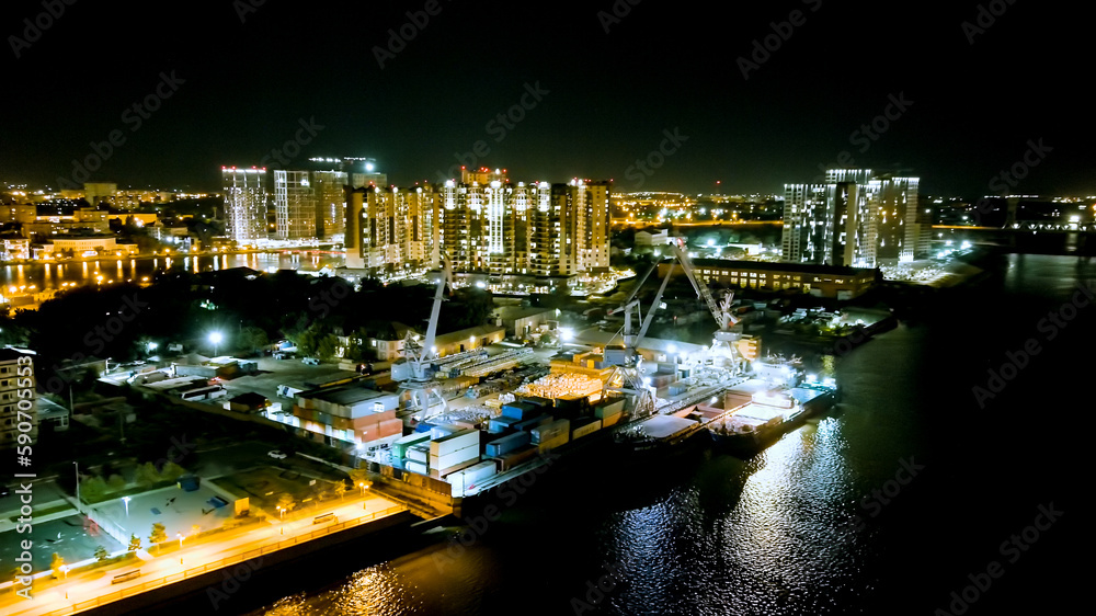 Astrakhan, Russia. Working port. Embankment of the Volga River. Night city lights, Aerial View