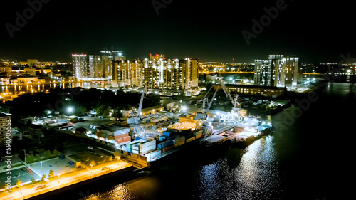 Astrakhan, Russia. Working port. Embankment of the Volga River. Night city lights, Aerial View © nikitamaykov