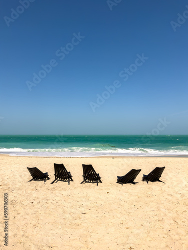 Sun loungers on the beach photo