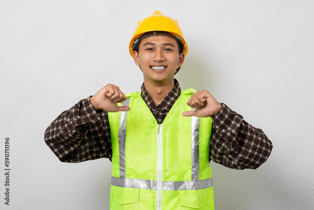 Young asian construction worker smiling pointing at himself isolated on white background