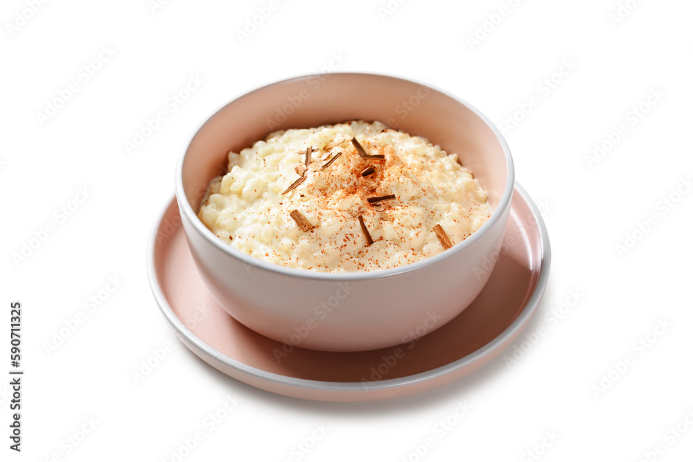 Fresh prepared rice pudding garnished with cinnamon flakes. Healthy breakfast for every day. Isolated on white background. Fresh prepared rice pudding garnished with cinnamon flakes. Healthy breakfast for every day. Isolated on white background.