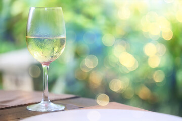 white wine tasting, chilled ice wine in a cold glass in summer