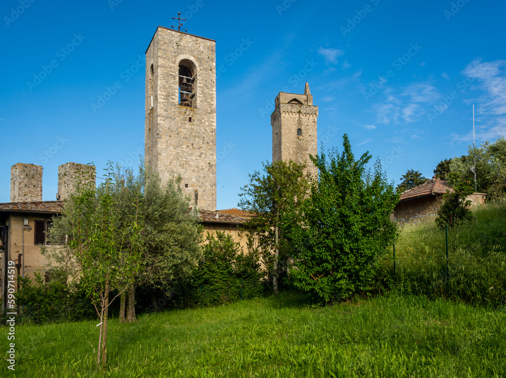 Belfry of Collegiata di Santa Maria Assunta Church and Torre Grossa Tower, San Gimignano, Tuscany (Toscana), Italy
