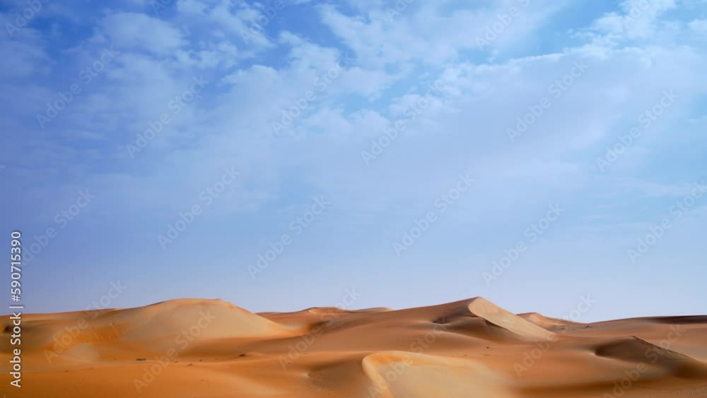 Beautiful dramatic clouds time lapse over the desert sand dune of Abu Dhabi, UAE Beautiful dramatic clouds time lapse over the desert sand dune of Abu Dhabi, UAE