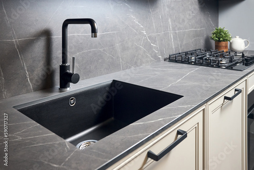 Fotobehang Kitchen sink area with black square matte sink tap in contemporary style