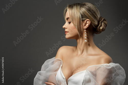Wallpaper Mural Elegant Lady Portrait in White Dress. Fashion Girl Face Profile with Bride Hair Bun. Woman in Wedding Gown over Gray Background Side View. Beautiful Model Side view Close up Torontodigital.ca