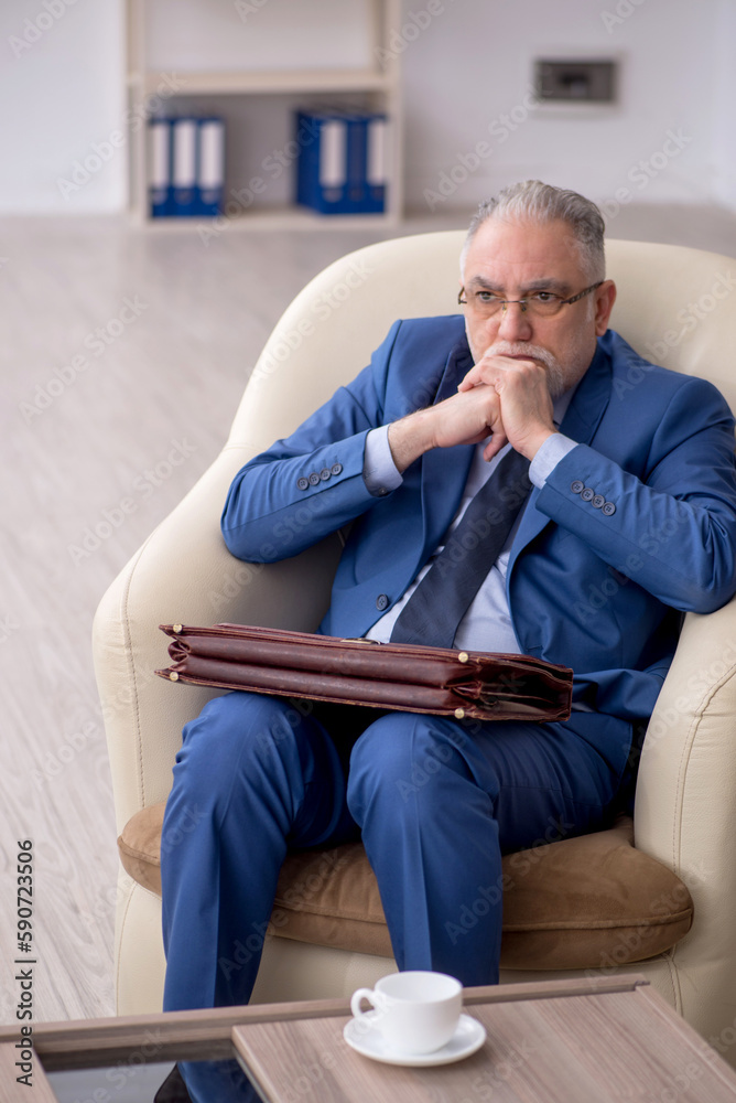 Old businessman waiting for business meeting Old businessman waiting for business meeting