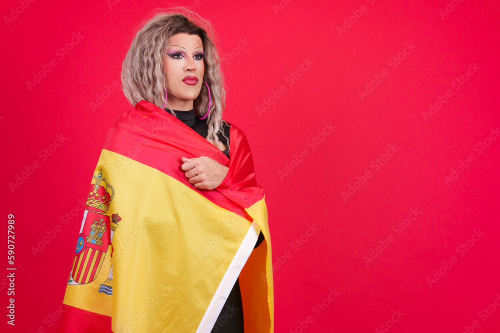 Serious transgender person wrapping with a spanish flag