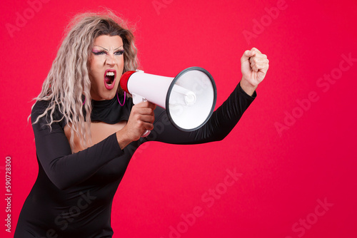 Fotografie Upset transgender person shouting using a loudspeaker