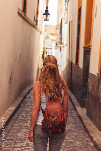 Woman tourist walking in spanish street © M.studio
