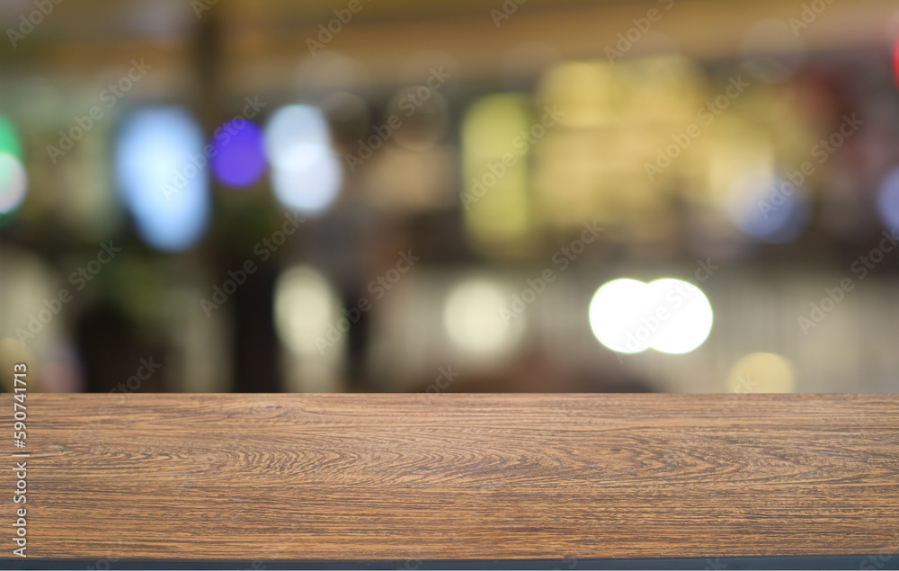Empty wooden table in front of abstract blurred background of coffee shop . can be used for display or montage your products.Mock up for display of product Empty wooden table in front of abstract blurred background of coffee shop . can be used for display or montage your products.Mock up for display of product
