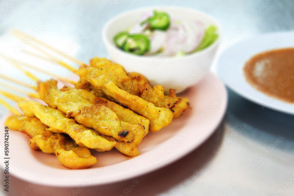 Pork Satay with your Peanut Sauce. It is a dish made from thinly sliced meat. or cut into cubes It may be pork, chicken, beef, lamb, goat meat, fish, etc., plugged with a skewer made of bamboo. Then g Pork Satay with your Peanut Sauce. It is a dish made from thinly sliced meat. or cut into cubes It may be pork, chicken, beef, lamb, goat meat, fish, etc., plugged with a skewer made of bamboo. Then g