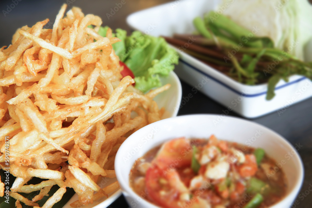 Fried Papaya Salad (Som Tum Tod) Served with vegetables, Thai Food, selective focus, close up Fried Papaya Salad (Som Tum Tod) Served with vegetables, Thai Food, selective focus, close up