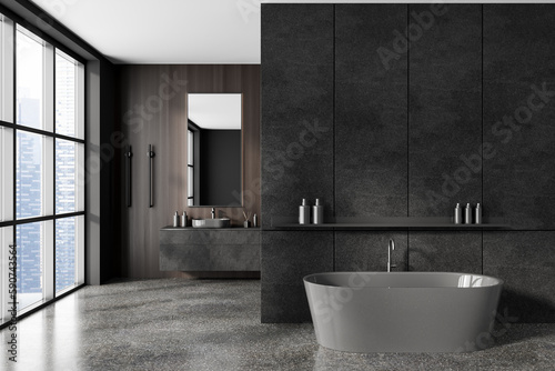 Stylish bathroom interior with sink and tub  empty dark concrete wall