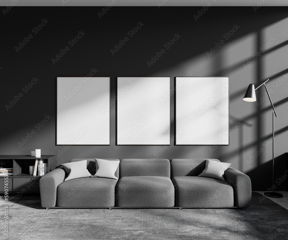 Gray living room with couch and posters