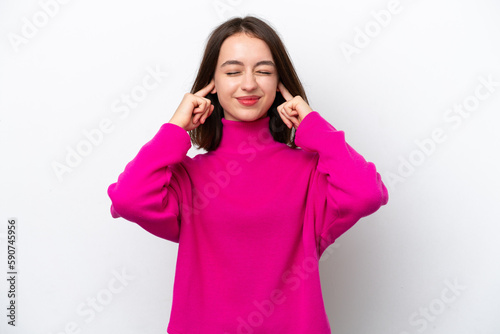 Young Ukrainian woman isolated on white background frustrated and covering ears