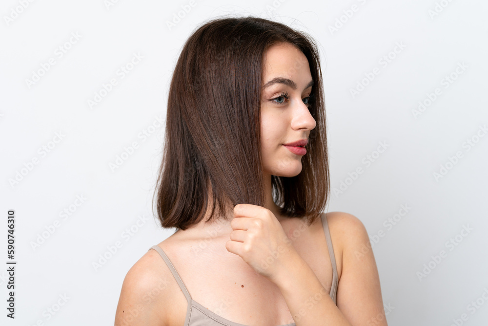 Young Ukrainian woman isolated on white background touching her hair. Close up portrait Young Ukrainian woman isolated on white background touching her hair. Close up portrait