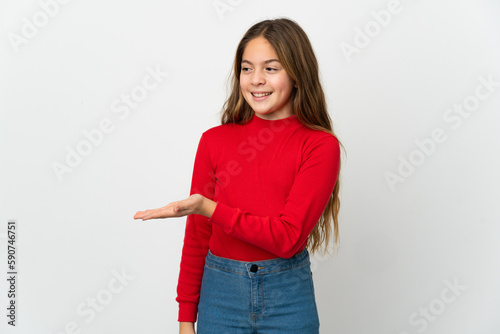 Little girl over isolated white background presenting an idea while looking smiling towards