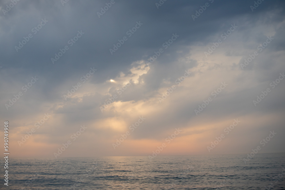 Sunset on the sea, sky with clouds, summer.