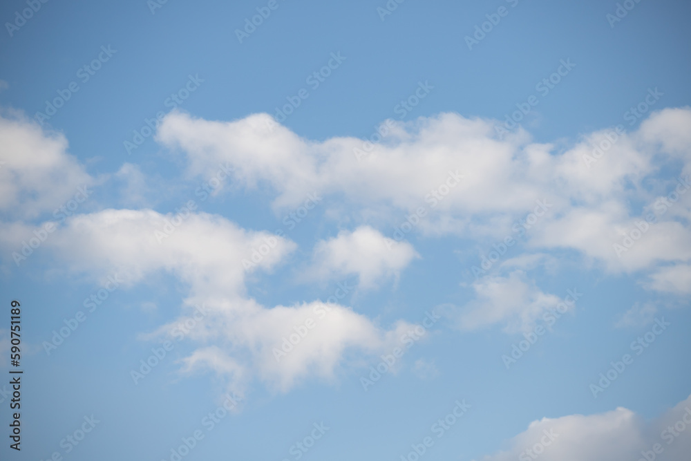 Blue sky with white fluffy clouds in sunny weather. Blue sky with white fluffy clouds in sunny weather.