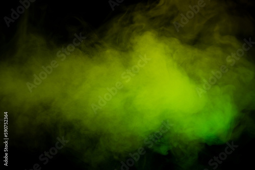 Yellow and green steam on a black background.