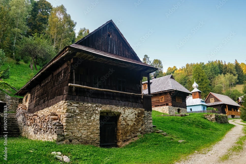 Picturesque scenery of old country houses in a mountain environment. Village of Drabsko, Slovakia, rural concept, sunset light, pure nature. Discover the beauty of the world. Picturesque scenery of old country houses in a mountain environment. Village of Drabsko, Slovakia, rural concept, sunset light, pure nature. Discover the beauty of the world.