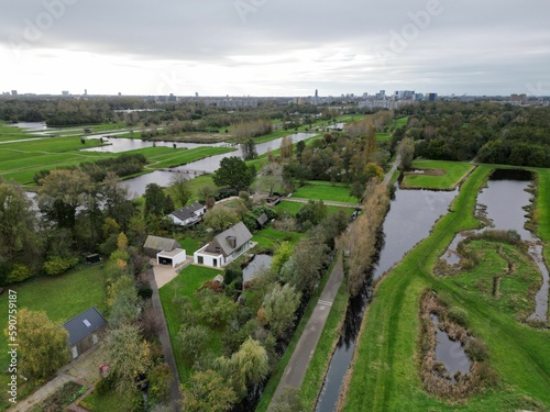 Aerial view over rural houses with trees and canals in Veenendaal, Utrecht Netherlands photo