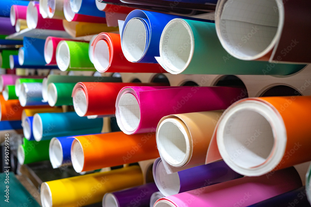 Vinyl selfadhesive film on the shelves of the store.Sale of multicolored film for design and