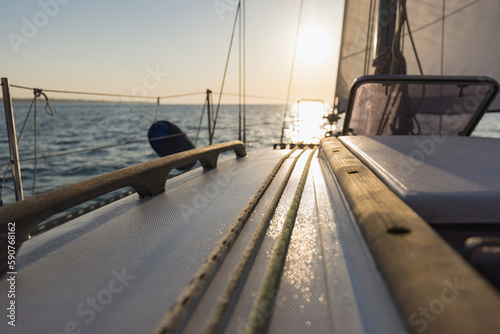 Sailboat yacht sailing in the sea at colorful sunset © 24K-Production