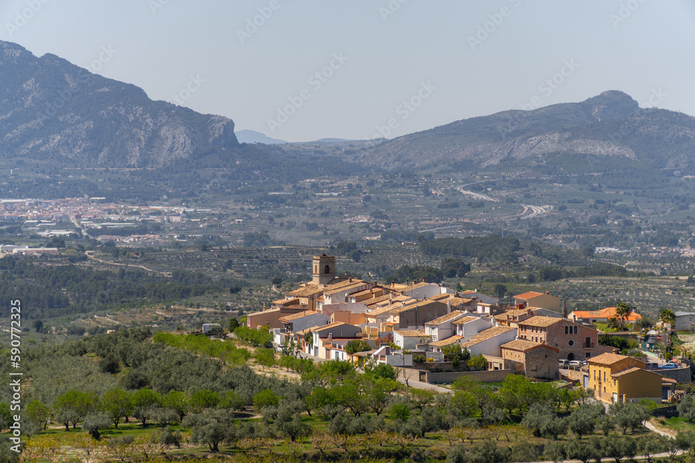 Small town with mountains on the background. In Catamarruch, Alicante (Spain).