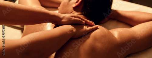 Aromatherapy massage, Masseuse hand massage aroma on back a man customer in cosmetology spa centre.