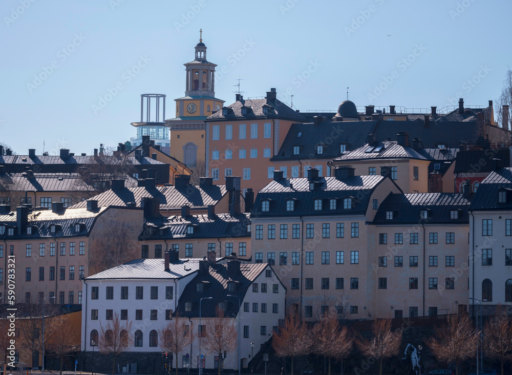 Obraz premium Old apartment houses on the cliff Mariaberget, a sunny spring day in Stockholm